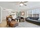 Open-concept living room and kitchen area with modern furnishings and natural light at 455 Registry Blf, Stone Mountain, GA 30087