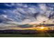 Beautiful landscape with a sunset on the horizon, with trees and colorful clouds at 133 Laurel Brook Ln, Canton, GA 30115