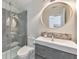 This bathroom features a glass enclosed shower and a vanity with a round mirror at 1250 Rosette Way, Marietta, GA 30062