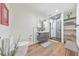 Modern bathroom featuring a floating vanity, tiled shower, and decorative shelving at 1250 Rosette Way, Marietta, GA 30062