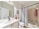 Cozy bathroom features a shower-tub combo, modern finishes, and decorative wall accents at 1250 Rosette Way, Marietta, GA 30062