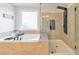Beautiful tub and separate walk-in shower provide a luxurious bathing experience at 1250 Rosette Way, Marietta, GA 30062