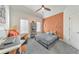 Bedroom features a desk, a bed with decorative pillows, and a ceiling fan at 1250 Rosette Way, Marietta, GA 30062