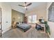 This bedroom features a guitar, a computer, and a small bed with a gray comforter at 1250 Rosette Way, Marietta, GA 30062