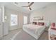 Bright bedroom featuring large windows, a modern ceiling fan and ample space at 1250 Rosette Way, Marietta, GA 30062