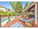 Relaxing deck area with lounge chairs, grilling station, and views of the refreshing backyard pool at 1250 Rosette Way, Marietta, GA 30062