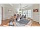 Elegant dining room boasts hardwood floors, decorative trim, and a modern light fixture at 1250 Rosette Way, Marietta, GA 30062