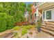 Charming home entrance with stone steps, a landscaped garden, and a welcoming front door at 1250 Rosette Way, Marietta, GA 30062