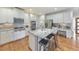 Modern kitchen with an island, stainless appliances, granite counters, and white cabinetry at 1250 Rosette Way, Marietta, GA 30062