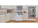 Updated kitchen featuring stainless steel appliances, granite countertops, and hardwood floors at 1250 Rosette Way, Marietta, GA 30062