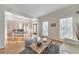Bright and airy living room features hardwood floors, shutters, and a view into the dining area at 1250 Rosette Way, Marietta, GA 30062