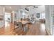 Open concept featuring hardwood floors, dining area, and living room with natural light at 1250 Rosette Way, Marietta, GA 30062