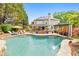 Resort style pool boasts captivating waterfall features, meticulously landscaped grounds and inviting lounge at 1250 Rosette Way, Marietta, GA 30062