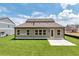 Expansive backyard with well-kept lawn, ready for outdoor entertaining with a private patio and green space at 329 Willow Cv, Canton, GA 30114