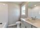Bright bathroom features a modern vanity, sleek fixtures, and a tiled shower-tub combo at 329 Willow Cv, Canton, GA 30114