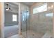 Modern bathroom boasts a glass enclosed shower with stone tile and a built-in bench at 329 Willow Cv, Canton, GA 30114