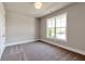 Cozy bedroom with neutral carpet and a large window offering ample natural light at 329 Willow Cv, Canton, GA 30114