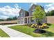 Well-manicured lawn, fresh landscaping, and a classic exterior create an inviting curb appeal for this two-story home at 329 Willow Cv, Canton, GA 30114