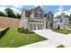 Charming two-story home with two-car garage, beautifully landscaped lawn, and traditional design elements at 329 Willow Cv, Canton, GA 30114