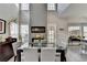 Bright dining area boasts high ceilings, a contemporary fireplace, and multiple large windows at 3986 Church View Ln, Suwanee, GA 30024