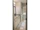 Bright bathroom with granite counters, vanity with storage, and tile floor at 4241 Summer Breeze Way, Buford, GA 30518