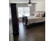 Cozy bedroom featuring a ceiling fan, hardwood floors, and ample natural light at 4241 Summer Breeze Way, Buford, GA 30518