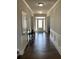 Inviting foyer with hardwood floors, paneled walls, and a bright front door with sidelights at 4241 Summer Breeze Way, Buford, GA 30518