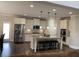 This stylish kitchen has granite counters, stainless appliances, a large island with bar seating at 4241 Summer Breeze Way, Buford, GA 30518