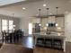 Bright kitchen with a center island, stainless steel appliances, and breakfast nook at 4241 Summer Breeze Way, Buford, GA 30518