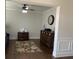 Cozy living room featuring dark hardwood floors, neutral paint and a ceiling fan at 4241 Summer Breeze Way, Buford, GA 30518