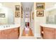 Bright bathroom with a soaking tub, shower, double sinks, and artwork at 8095 Georgetown Cir, Suwanee, GA 30024