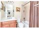 Neutral bathroom with a vanity, toilet, and shower/tub combination with a curtain at 8095 Georgetown Cir, Suwanee, GA 30024