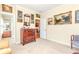 Neutral bedroom with hardwood floors, antique-style furnishings and an adjoining bathroom at 8095 Georgetown Cir, Suwanee, GA 30024