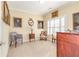 Charming bedroom featuring neutral walls, plantation shutters, and elegant antique-style furnishings at 8095 Georgetown Cir, Suwanee, GA 30024