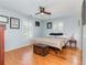 Bedroom with hardwood floors, natural light, and ceiling fan at 8095 Georgetown Cir, Suwanee, GA 30024