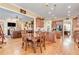 Open concept living featuring a dining area with hardwood floors and a seamless flow to the kitchen at 8095 Georgetown Cir, Suwanee, GA 30024