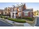 Charming brick home featuring a manicured front yard and classic architectural details at 8095 Georgetown Cir, Suwanee, GA 30024
