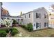 Charming exterior view highlighting the architectural details and landscaping of this townhome at 8095 Georgetown Cir, Suwanee, GA 30024