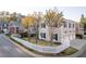 Charming home with a white picket fence, mature trees, and well-maintained landscaping at 8095 Georgetown Cir, Suwanee, GA 30024