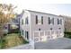 Spacious three-car garage with pristine floors and ample parking space for vehicles at 8095 Georgetown Cir, Suwanee, GA 30024