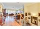 Elegant landing with hardwood floors, decorative art, and views of office area at 8095 Georgetown Cir, Suwanee, GA 30024