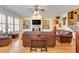An inviting living room with custom built-ins, a fireplace, and elegant furnishings at 8095 Georgetown Cir, Suwanee, GA 30024