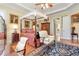 Main bedroom boasts a four-poster bed, elegant decor, and ample natural light at 8095 Georgetown Cir, Suwanee, GA 30024