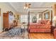 Spacious main bedroom featuring a canopy bed, wood floors, and decorative accents at 8095 Georgetown Cir, Suwanee, GA 30024