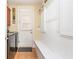 Functional mud room area featuring a bench, coat hooks, and direct access to the outdoors at 8095 Georgetown Cir, Suwanee, GA 30024