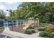 Community playground area with slides, climbing structures, and a safety surface at 8095 Georgetown Cir, Suwanee, GA 30024
