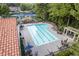 Community swimming pool with lounge seating, umbrellas, and a well-kept deck area at 8095 Georgetown Cir, Suwanee, GA 30024