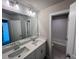 Bathroom with double sinks, large mirror and separate shower/tub room at 223 Willow St, Canton, GA 30114