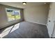 Bedroom with a bright window, wall to wall carpeting and a closet at 223 Willow St, Canton, GA 30114