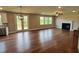 Spacious living room with hardwood floors, fireplace and door to deck at 223 Willow St, Canton, GA 30114